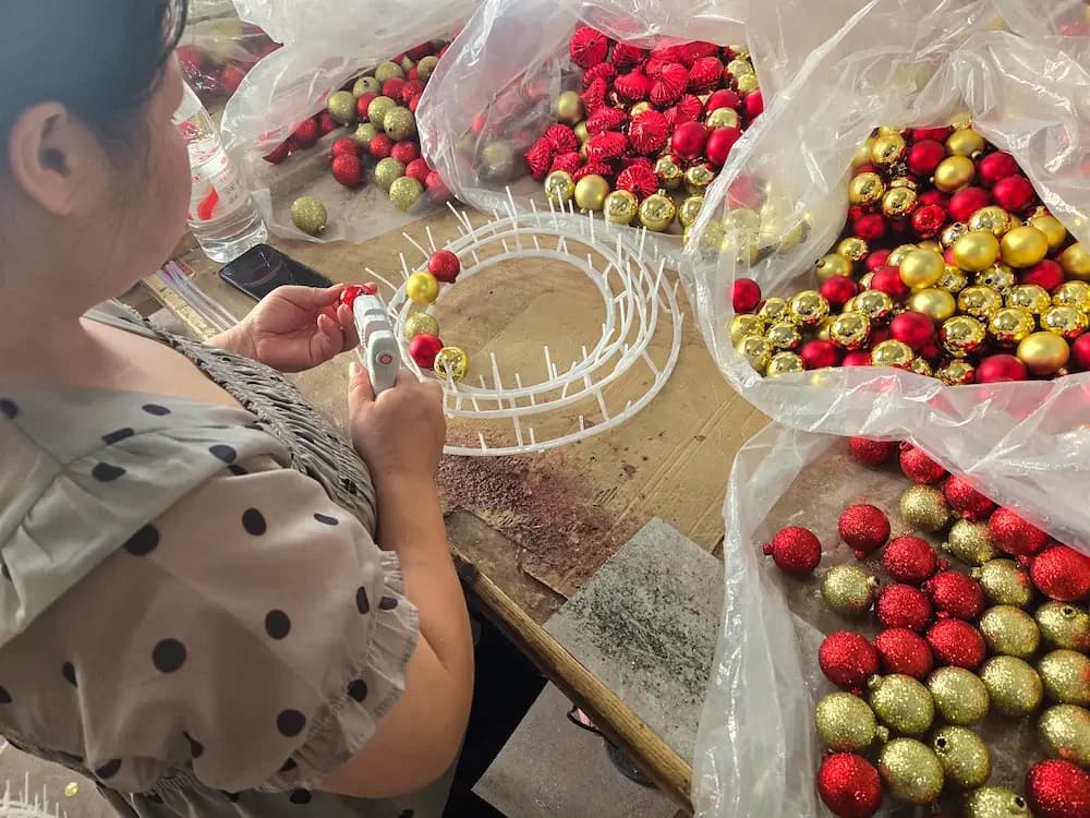 Glass Christmas ornament drying process after coating at a factory coating bay