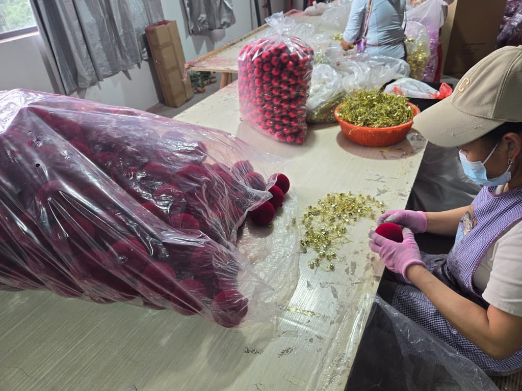 OEM Christmas ornament hand assembly review during design consultation — Christmas ornament manufacturer and Christmas ornaments wholesale production at Shuanglin Crafts factory in China